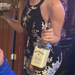 Form fitting black and gold cocktail dress